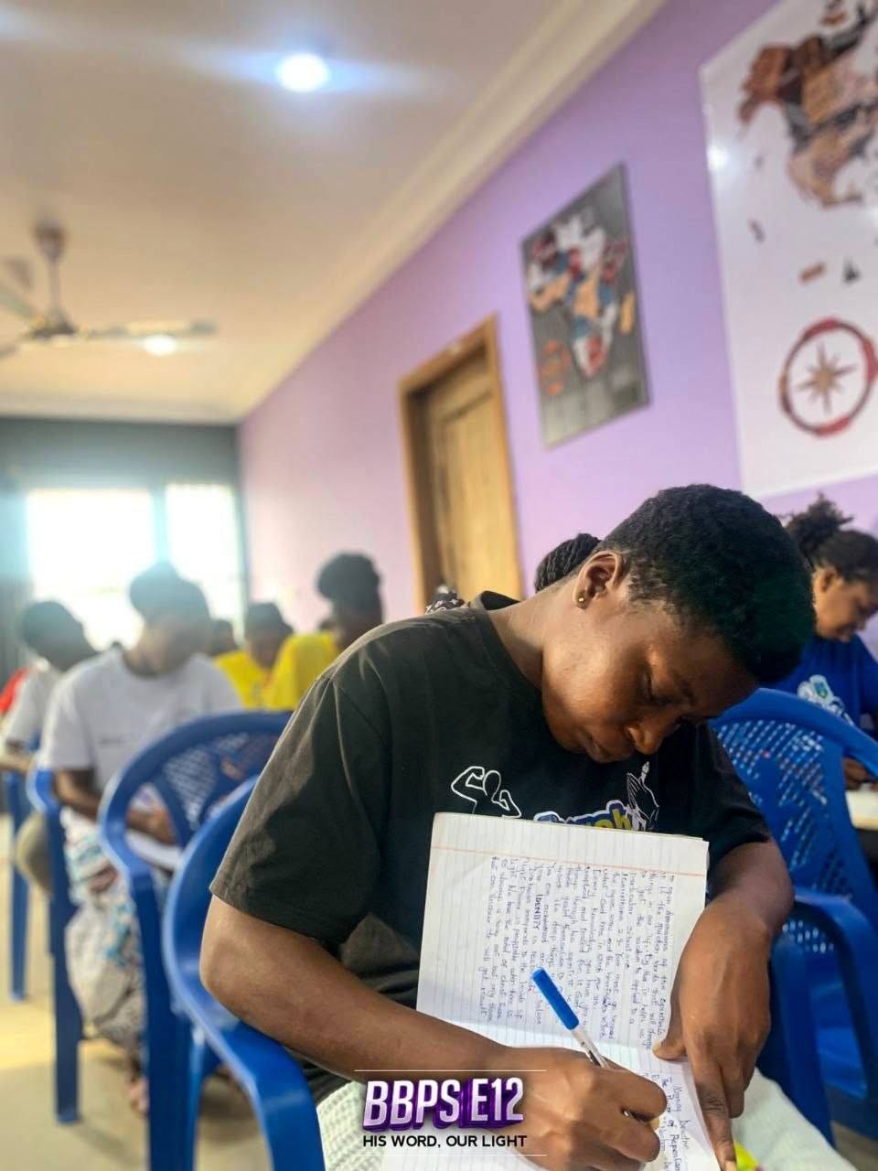 Participant taking notes during preaching and teaching