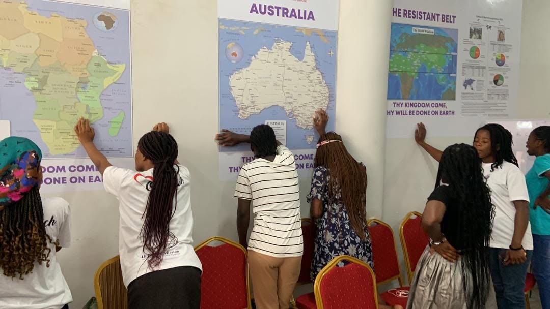 Participants praying for nations during intercession