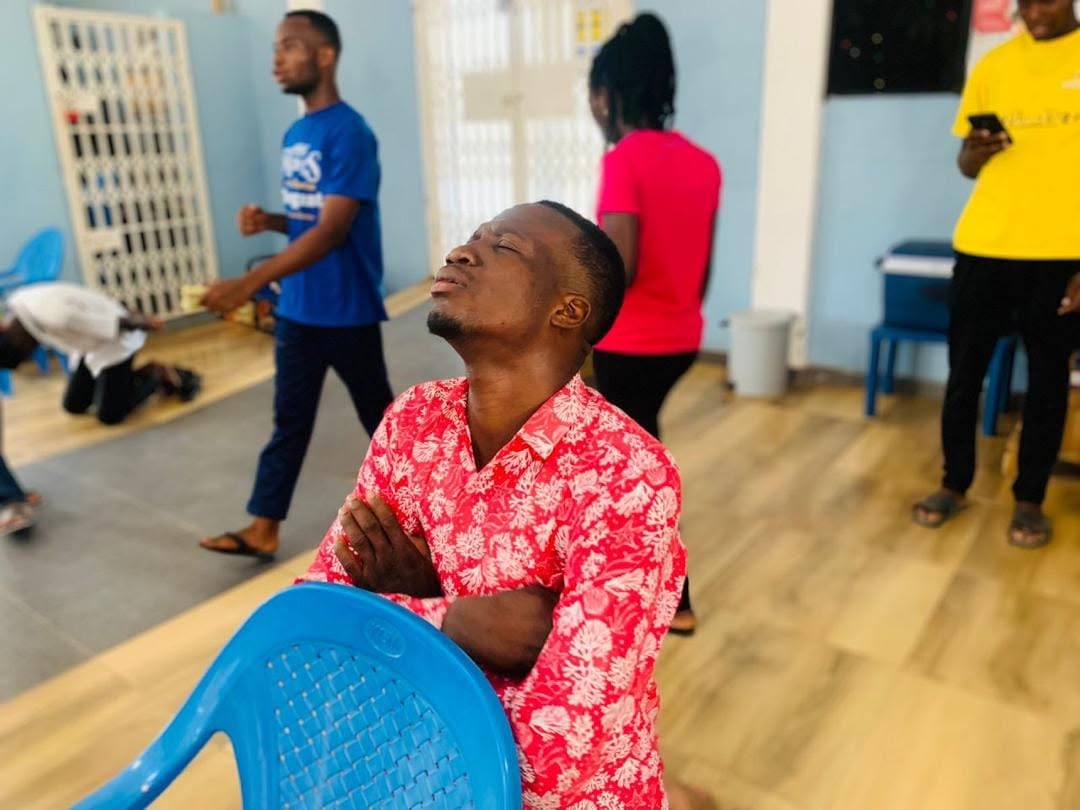 Participant praying during a Hope Hills Mission gathering